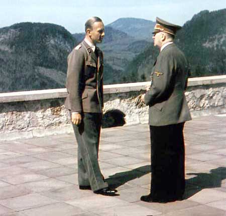 Martin Bormann's adjutant, SS Obersturmbannführer Fritz Darges, with Hitler on the terrace of the Berghof.