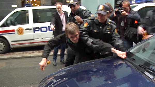madman lunges at unmarsked police car